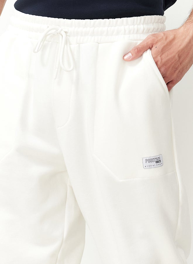 trendyol Ecru Regular Fit Label Appliqued Pockets Stitched Sweatpants TMNSS23EA00010 - Image 5