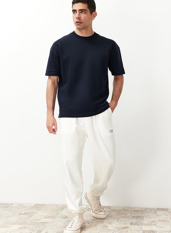 trendyol Ecru Regular Fit Label Appliqued Pockets Stitched Sweatpants TMNSS23EA00010 - Image 2