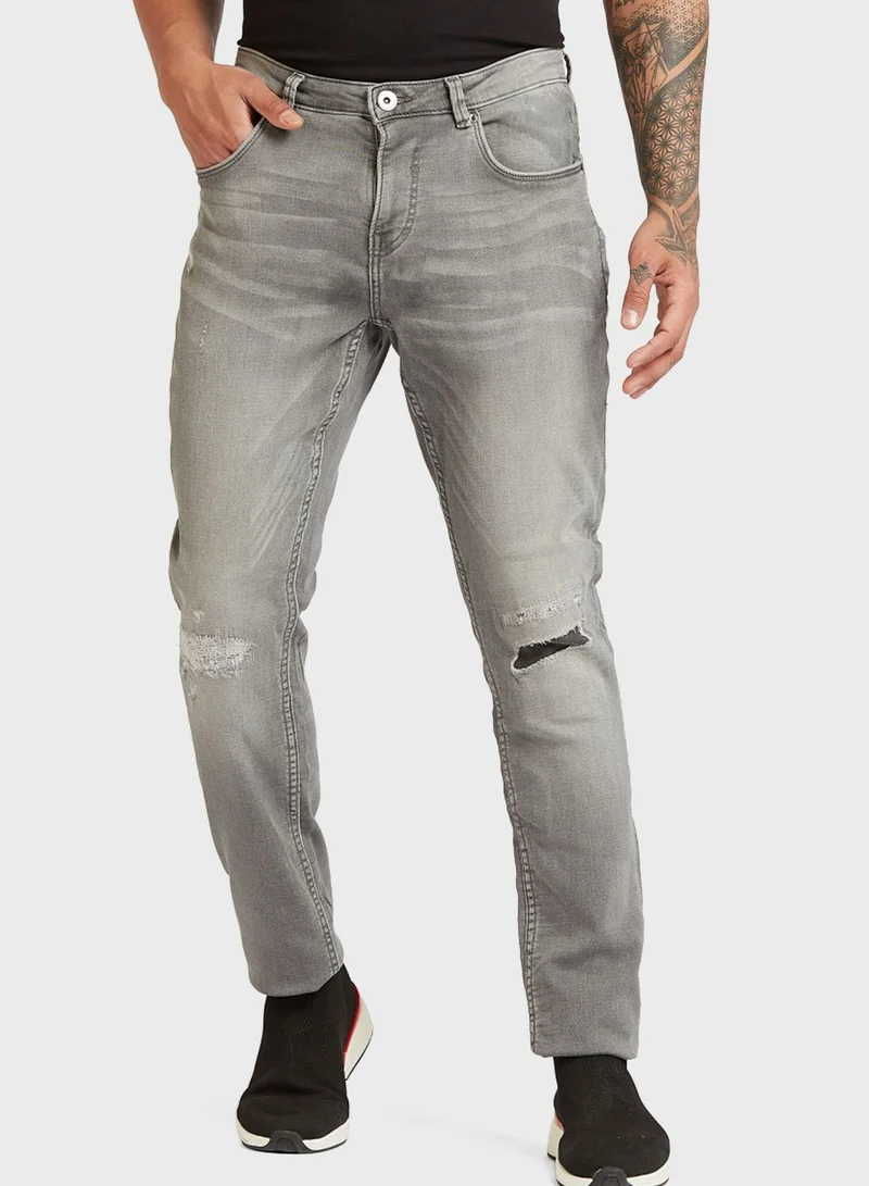 Iconic Distressed Slim Fit Jeans
