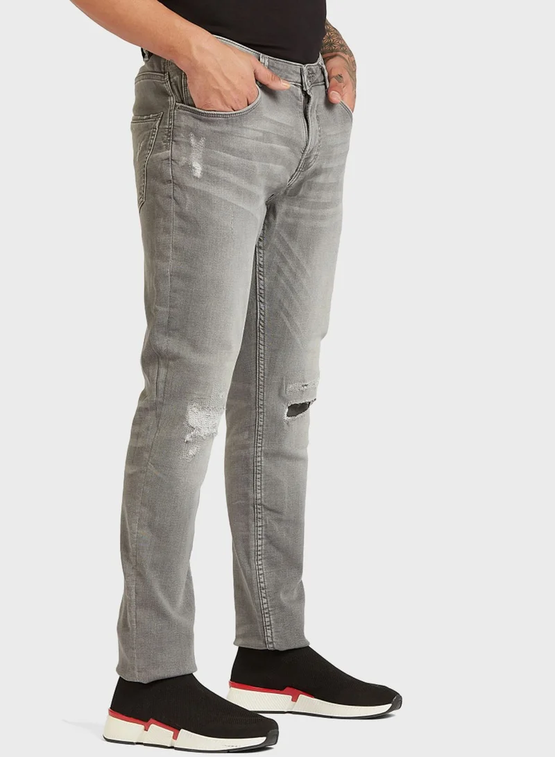 Iconic Distressed Slim Fit Jeans