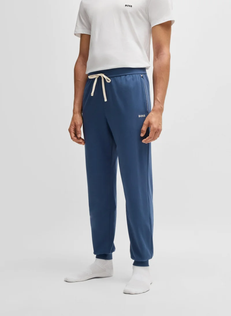 بوس Cuffed tracksuit bottoms in stretch cotton with embroidered logo