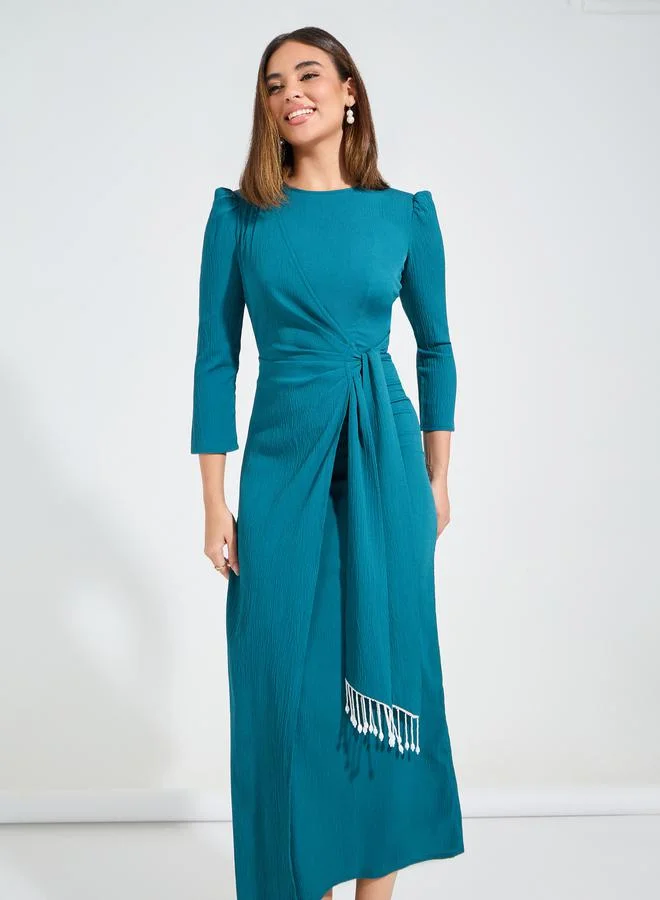 Styli Solid Wrap Maxi Dress with 3/4 Puff Sleeve & Tassels
