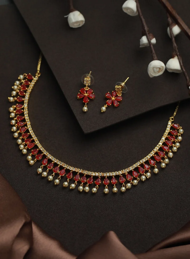 Priyaasi Women Red Floral Leaf Stone-Studded  White Beaded Jewellery Set