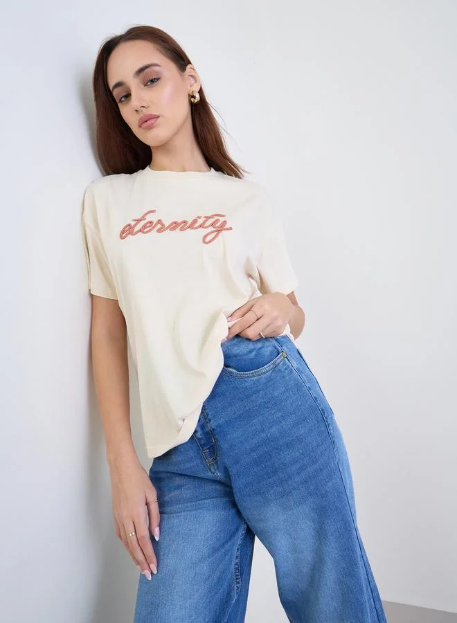 Styli Women Beige Infinity Rope Embroidered Short Sleeve T-Shirt