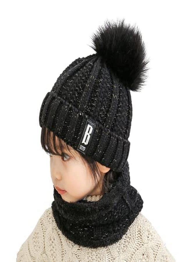 Malvina طقم قبعة شتوية صوفية ناعمة ودافئة ومقاومة للثلج من مالفينا للأطفال (أكبر من 12 سنة) (مزينة بكرة صوفية) ووشاح (مبطن بالفرو من الداخل) - عبوة من قطعة واحدة (أسود) - Image 1