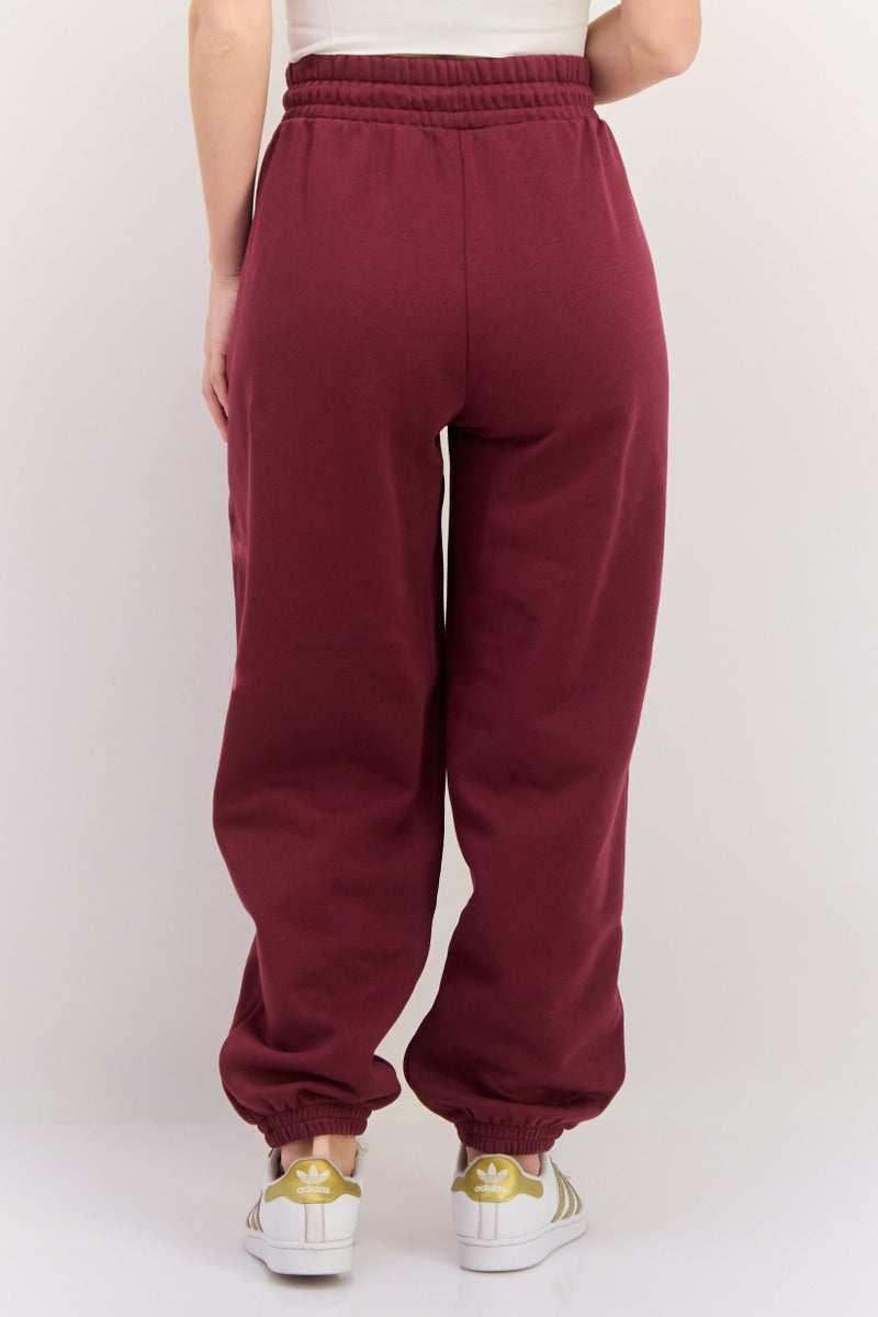 PUMA سروال رياضي خارجي للنساء بقصة مريحة مع حبل سحب، مارون - Image 3