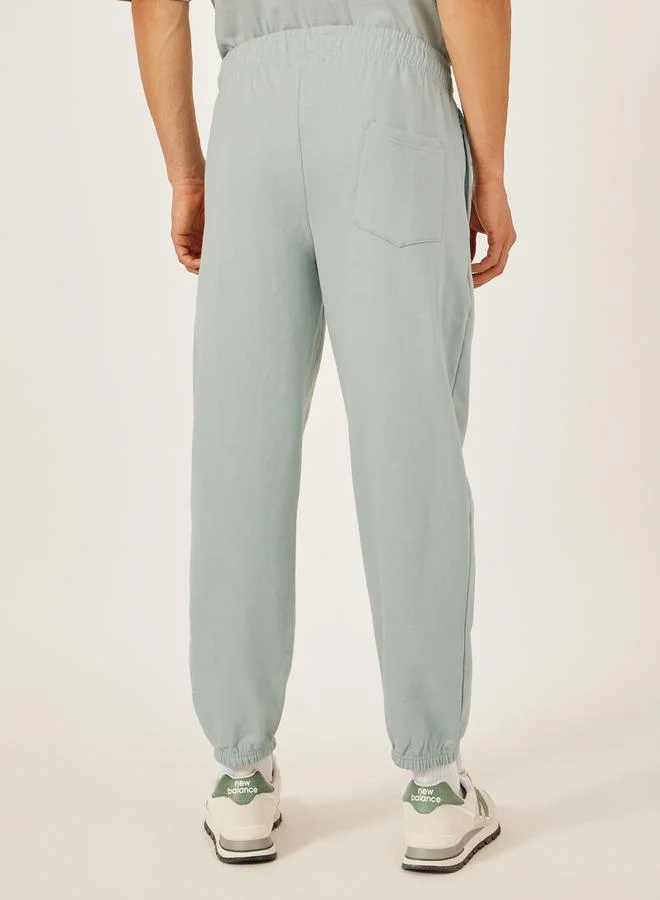 Styli Mid Rise Relaxed Fit Joggers with Badge Detail