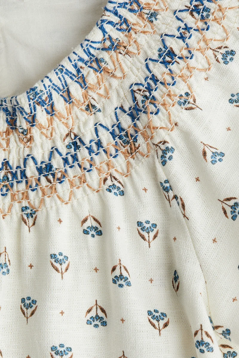 اتش اند ام فستان بتفاصيل سموك وخط