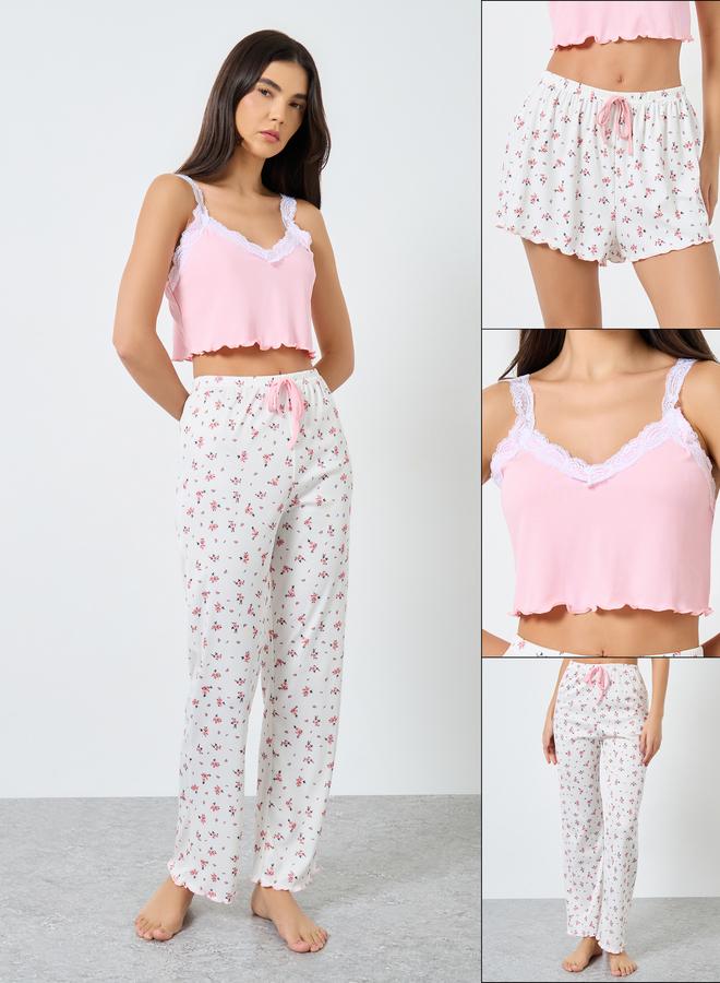 ستايلي طقم بيجاما من قطعتين: بلوزة قصيرة دانتيل وشورت مطبوع - Image 1