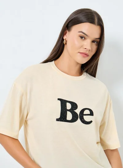 Styli Styli Beige Oversized Embellished Slogan T-Shirt