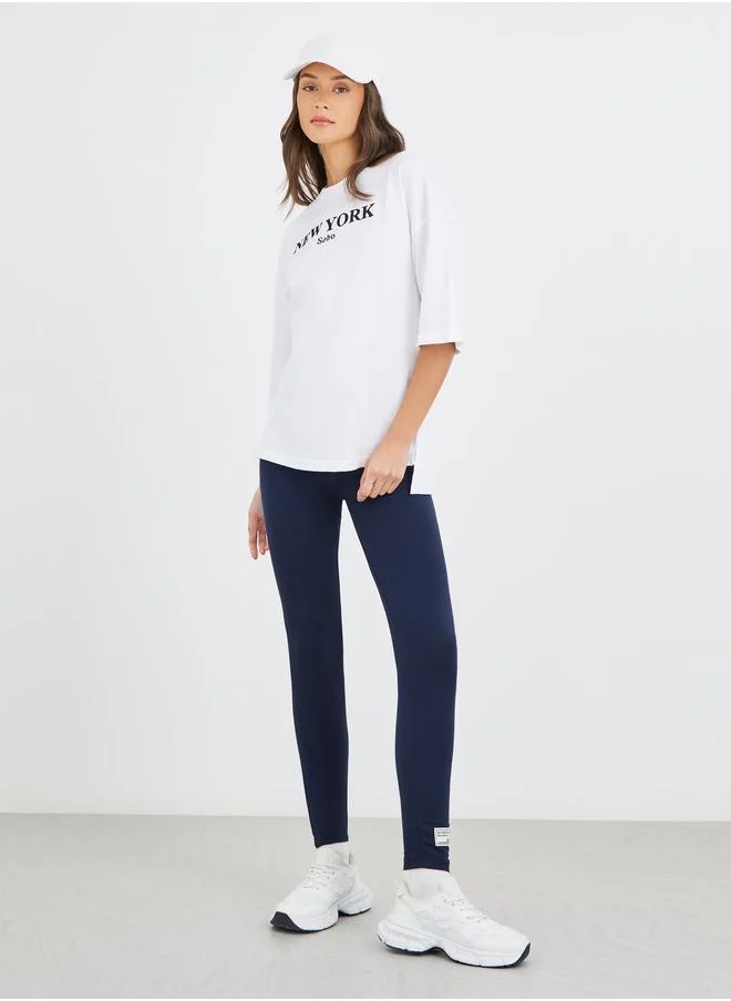 Styli Styli Text Embroidered Oversized T-Shirt and Badge Detail Leggings Co-Ords