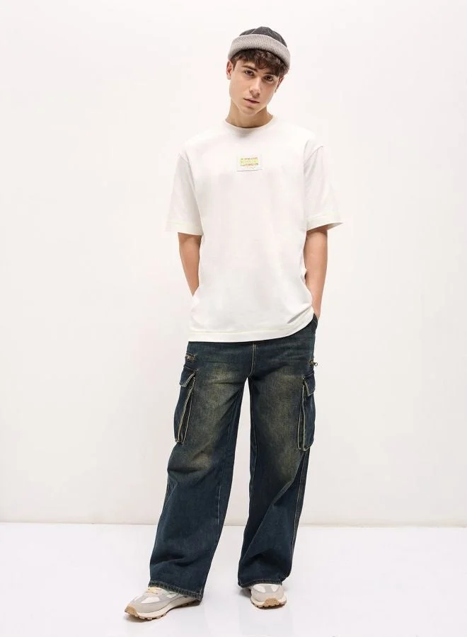 THE BEAR HOUSE  Men's White Oversize patch applique design Crew Neck T-shirt Perfect For Casual Wear, Gym, Travel, Or Layering Stylish And Versatile Essential For Every Wardrobe for Men | Best Price UAE