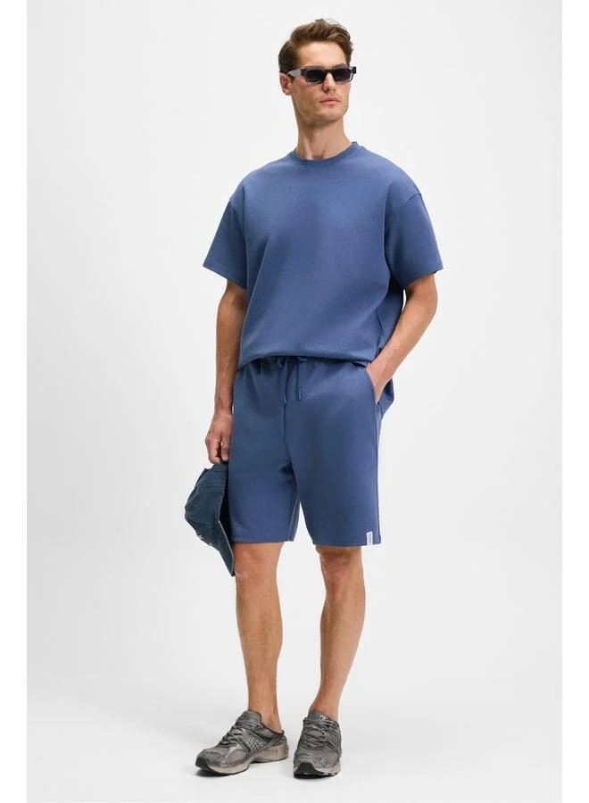 Grimelange BAILEY Men's Elastic Waist Back Single Pocket Corded Relaxed Fit Indigo Shorts.