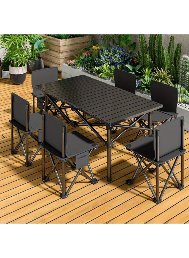 DubaiGallery A lightweight yet sturdy outdoor folding table paired with six compact chairs, designed for travel, camping, gardens, and patios, delivering reliable functionality, quick setup, excellent space efficiency, and a sleek black finish suitable for various outdoor dining and leisure environments. - Image 1