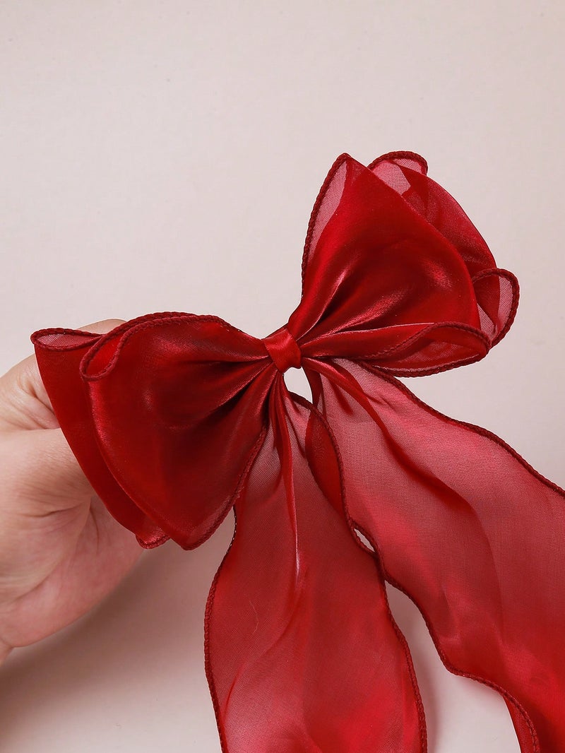 مشبك شعر نسائي كبير بتصميم فيونكة حريرية باللون الأحمر لإطلالة أنثوية أنيقة - Image 3