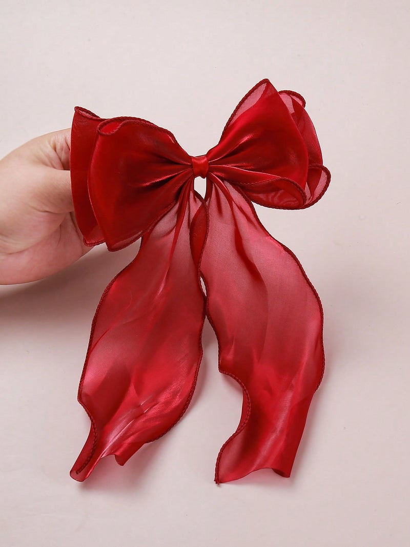 مشبك شعر نسائي كبير بتصميم فيونكة حريرية باللون الأحمر لإطلالة أنثوية أنيقة - Image 4