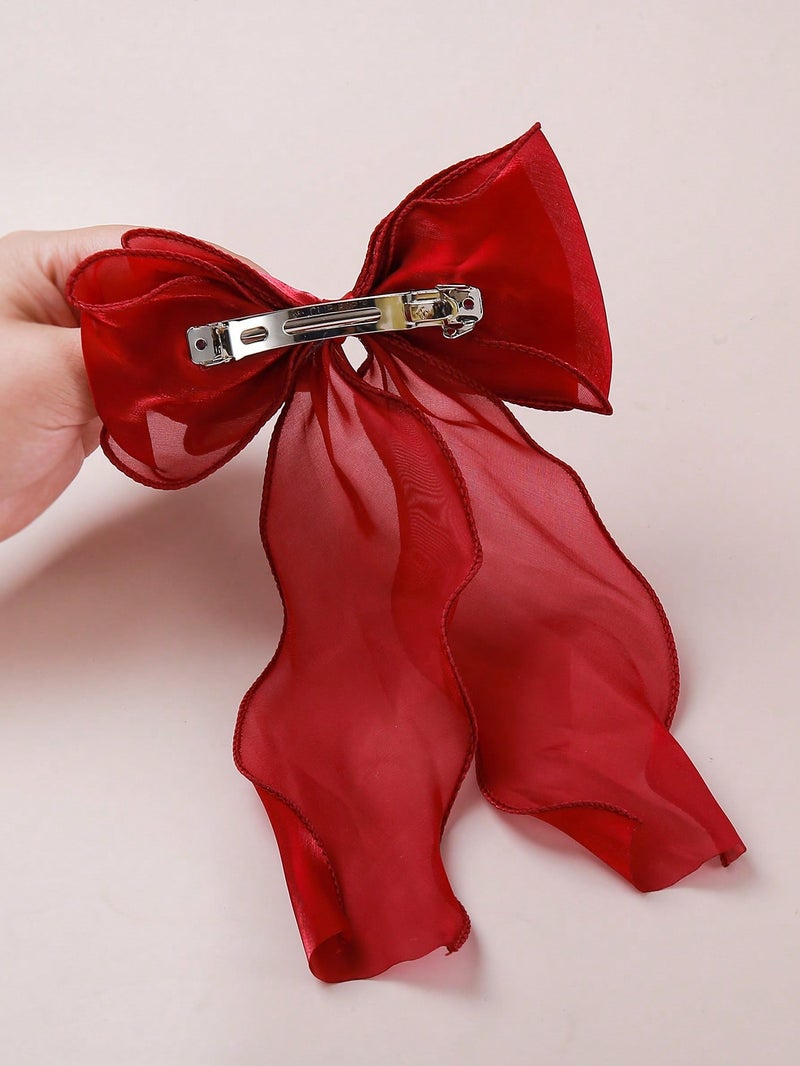 مشبك شعر نسائي كبير بتصميم فيونكة حريرية باللون الأحمر لإطلالة أنثوية أنيقة - Image 2