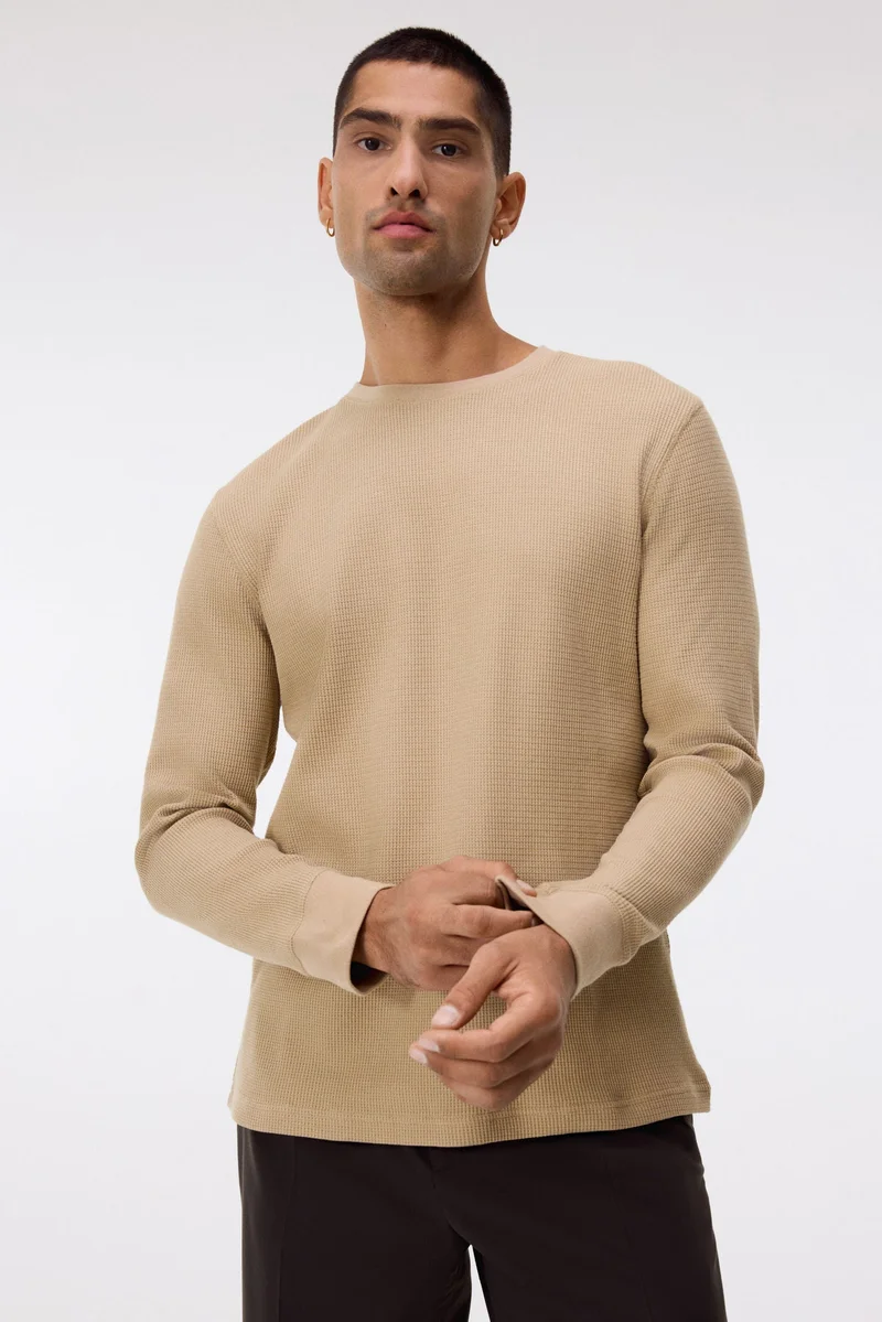 اتش اند ام بلوزة جيرسيه بتصميم الوافل