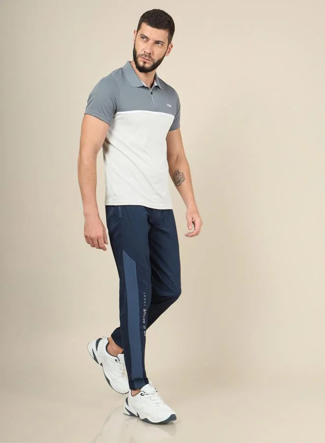 تكنوسبورت Solid Woven Stretch Track Pants with  Elastic Cuff by Styli