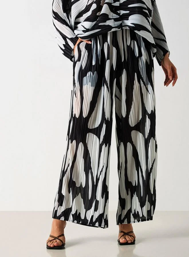 2Xtremz 2Xtremz All-Over Print Plisse Wide Leg Pants with Pockets