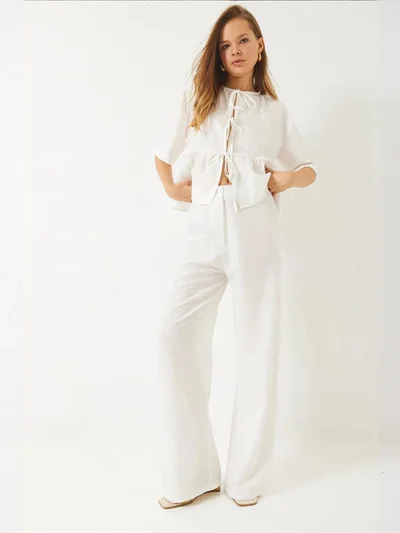 بيانكو لوتشي طقم قطعتين لوكسي بنقوش مع تفاصيل مكشكشة