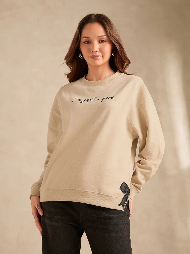 Outzidr  Beige Typographic Bow Sweatshirt for Women | Best Price UAE