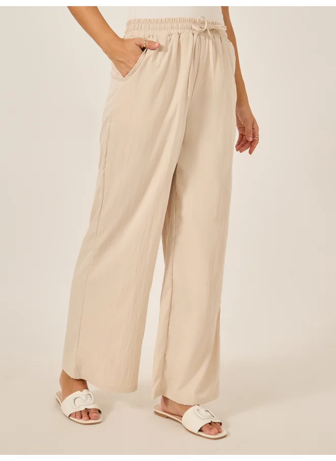 Styli Styli Plain Drawstring Waist Wide Leg Pants