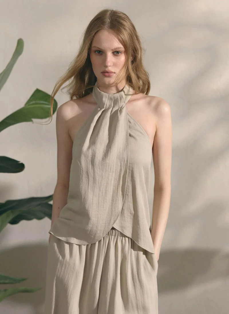 Draped textured top with halter neck