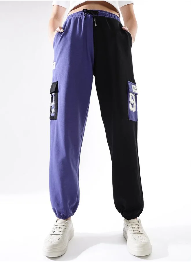 هوبرهولمي Women Track Pants in Multicolor featuring Jogger fit with a colourblocked pattern, no sleeves, regular length, secured with elasicated + drawstring closure, crafted from terry – designed to make a statement wherever you go.