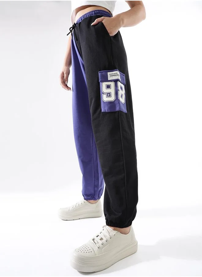 هوبرهولمي Women Track Pants in Multicolor featuring Jogger fit with a colourblocked pattern, no sleeves, regular length, secured with elasicated + drawstring closure, crafted from terry – designed to make a statement wherever you go.