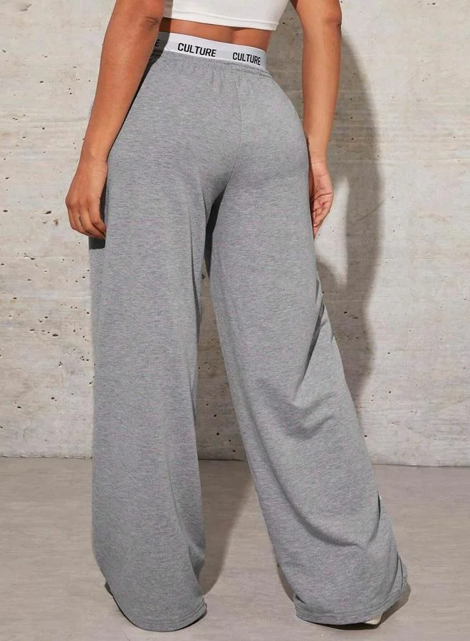 تايك تو بنطال واسع سادة بخصر مطاطي وحبل شد مع طبعة كتابة