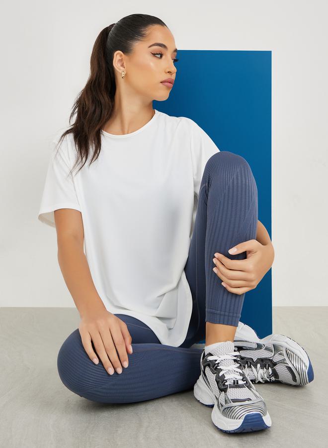 Styli Center Back Minimal Slogan In Line To Stripe Loose Yoga Top  - Image 1