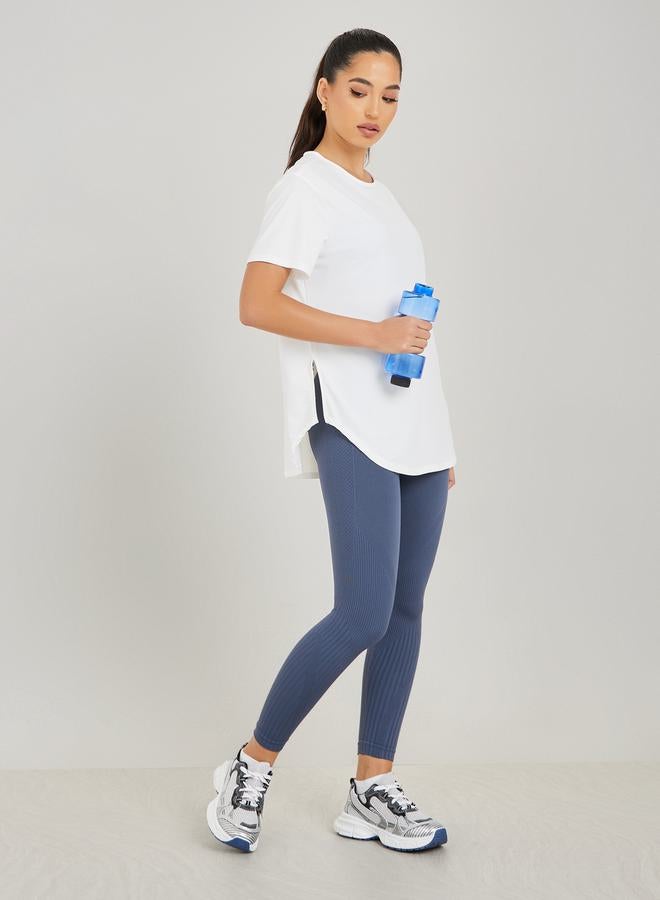 Styli Center Back Minimal Slogan In Line To Stripe Loose Yoga Top  - Image 2