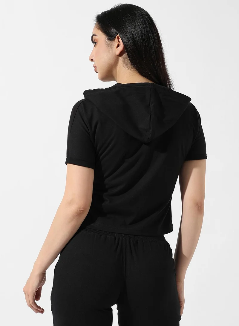 Campus Sutra Campus Sutra Women's Solid Black Hooded Cropped Top For Casual Wear | Crew Neck | Short Sleeve | Poly Cotton Top Crafted With Regular Sleeve & Comfort Fit For Everyday Wear