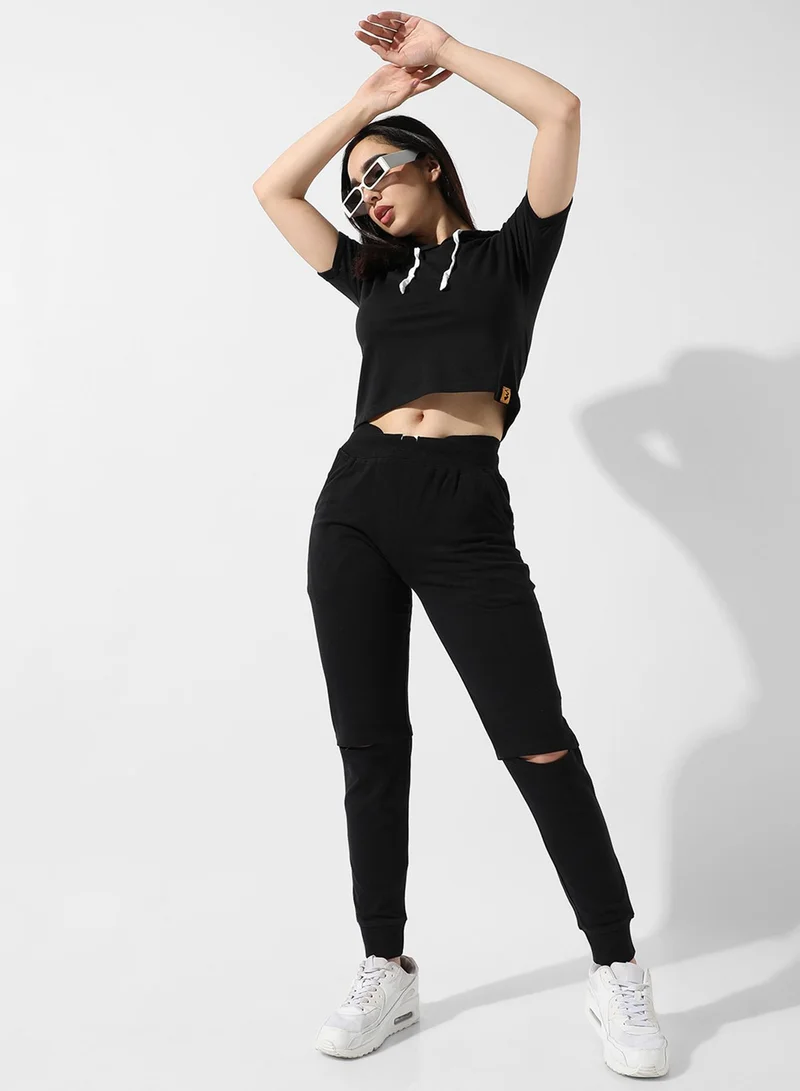 Campus Sutra Campus Sutra Women's Solid Black Hooded Cropped Top For Casual Wear | Crew Neck | Short Sleeve | Poly Cotton Top Crafted With Regular Sleeve & Comfort Fit For Everyday Wear