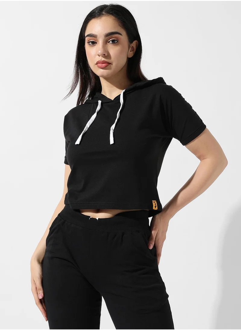 Campus Sutra Campus Sutra Women's Solid Black Hooded Cropped Top For Casual Wear | Crew Neck | Short Sleeve | Poly Cotton Top Crafted With Regular Sleeve & Comfort Fit For Everyday Wear