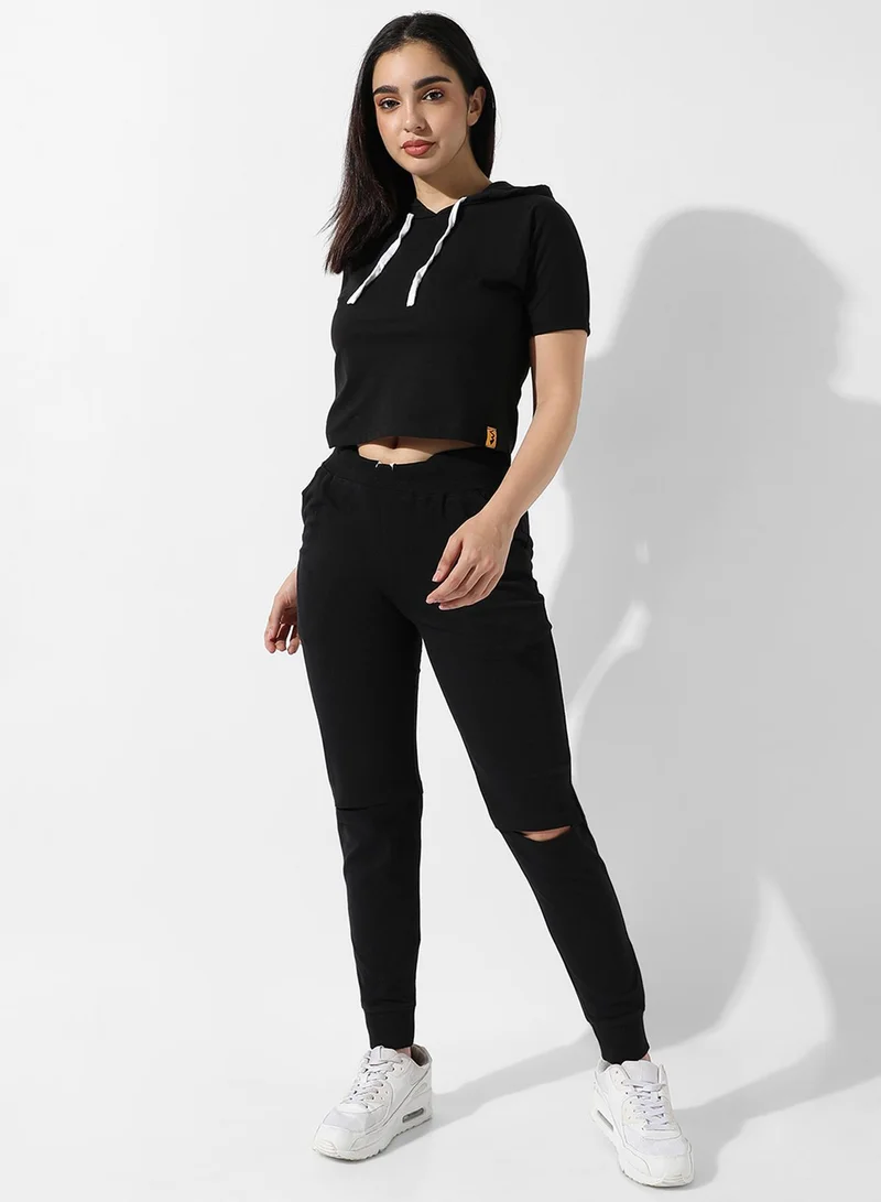 Campus Sutra Campus Sutra Women's Solid Black Hooded Cropped Top For Casual Wear | Crew Neck | Short Sleeve | Poly Cotton Top Crafted With Regular Sleeve & Comfort Fit For Everyday Wear