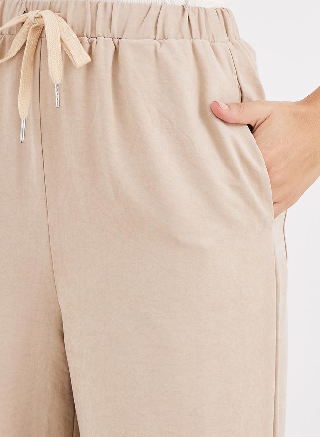Styli Women Cream Solid Drawstring Waist Wide Leg Pants - Image 3