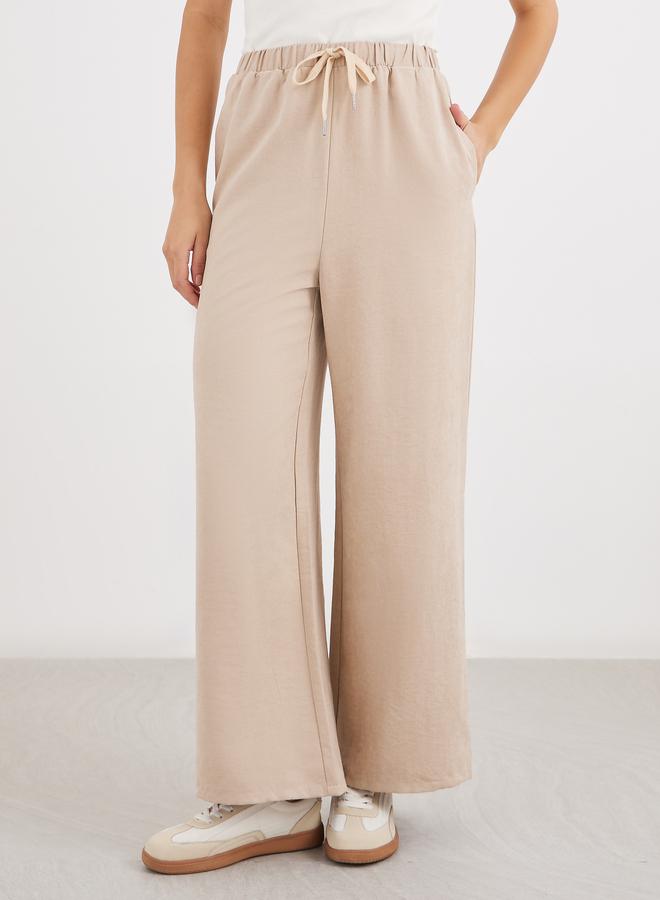 Styli Women Cream Solid Drawstring Waist Wide Leg Pants - Image 2