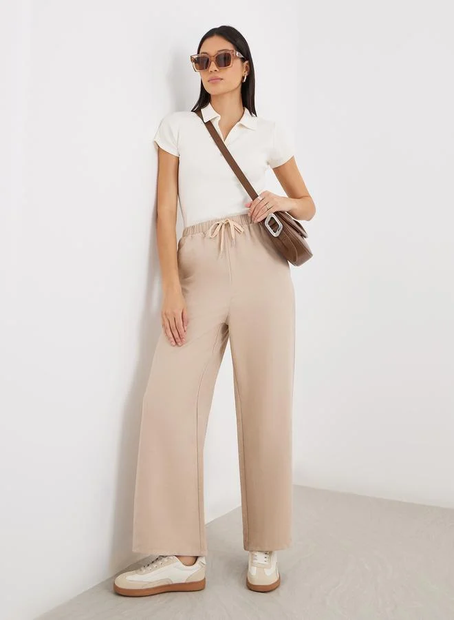ستايلي Styli Women Cream Solid Drawstring Waist Wide Leg Pants