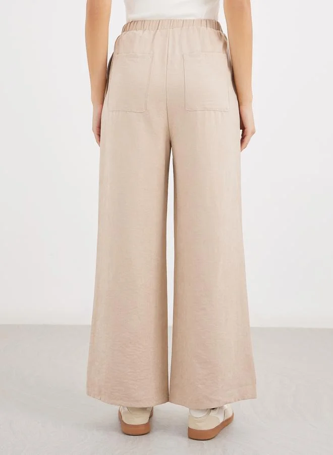 Styli Women Cream Solid Drawstring Waist Wide Leg Pants