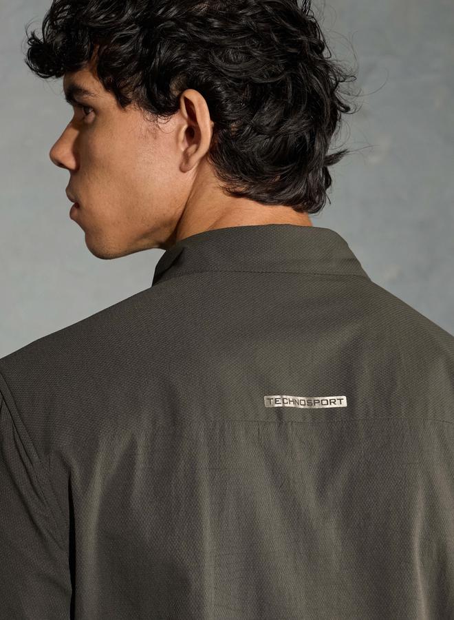 تكنوسبورت قميص تكنوسبورت بأكمام طويلة مطاطي ثنائي الاتجاه بقصة عادية - Image 4
