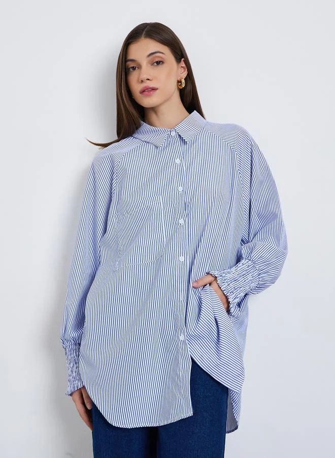 ستايلي بلوزة مخططة بقصة واسعة