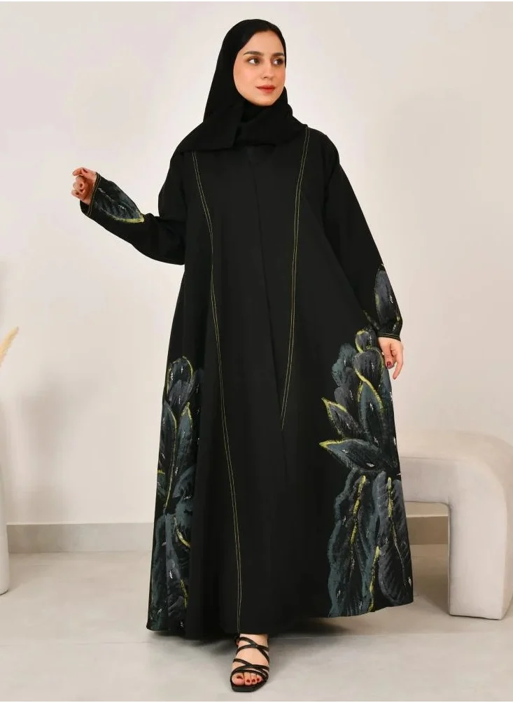 lamha abaya Black cloche abaya with floral print on the sides of the abaya and sleeves with prominent yellow stitching