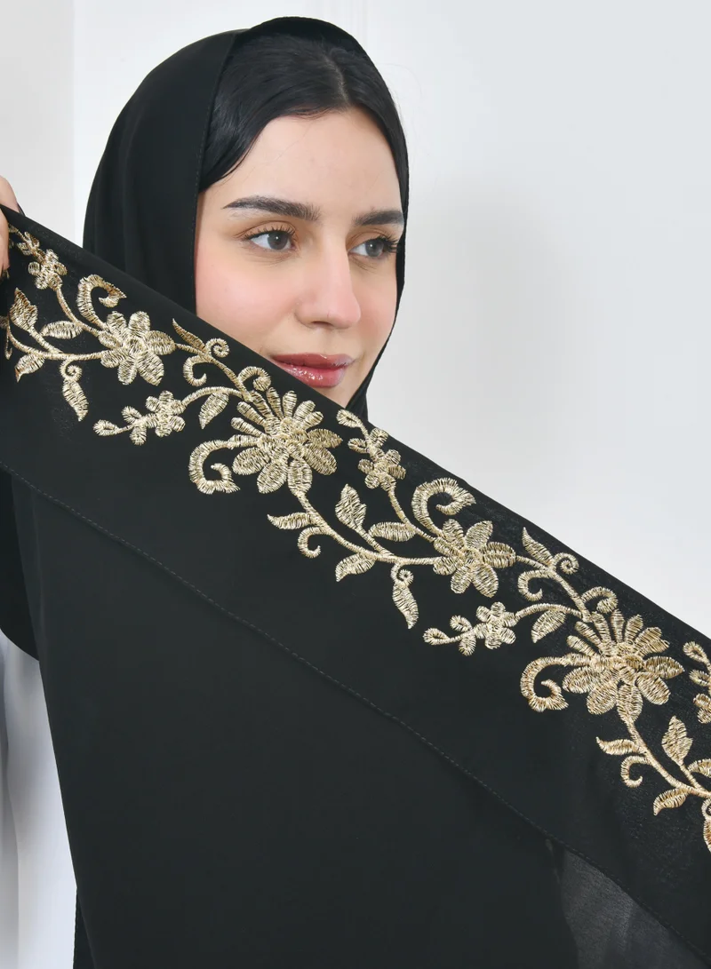 HAWRAA ABAYA Black linen veil with floral embroidery with golden threads