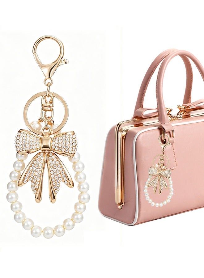 سلسلة مفاتيح على شكل فيونكة من حجر الراين الأبيض مع سلسلة مفاتيح على شكل فيونكة من اللؤلؤ الصناعي مع قلادة محفظة لامعة على شكل فيونكة للنساء - Image 1