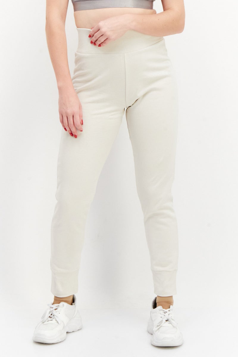 NA-KD Women Solid Basic Tapered Pull On Jogger Pants, Light Beige - Image 1
