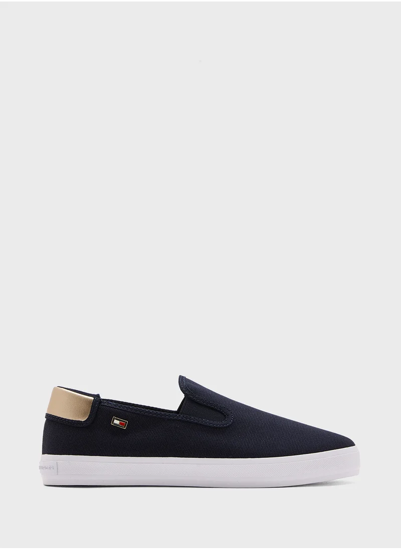 تومي هيلفيغر VULCANISED CANVAS SLIP ON TRAINERS