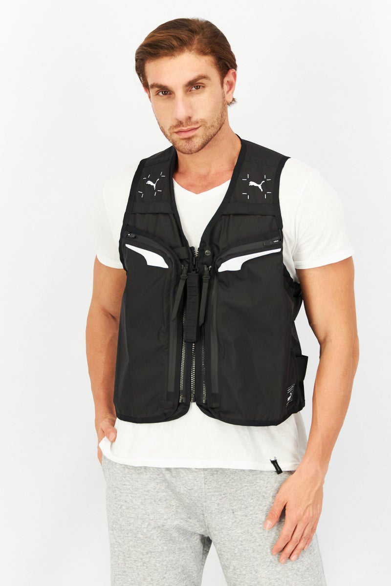PUMA سترة رياضية للرجال بدون أكمام، سوداء - Image 1
