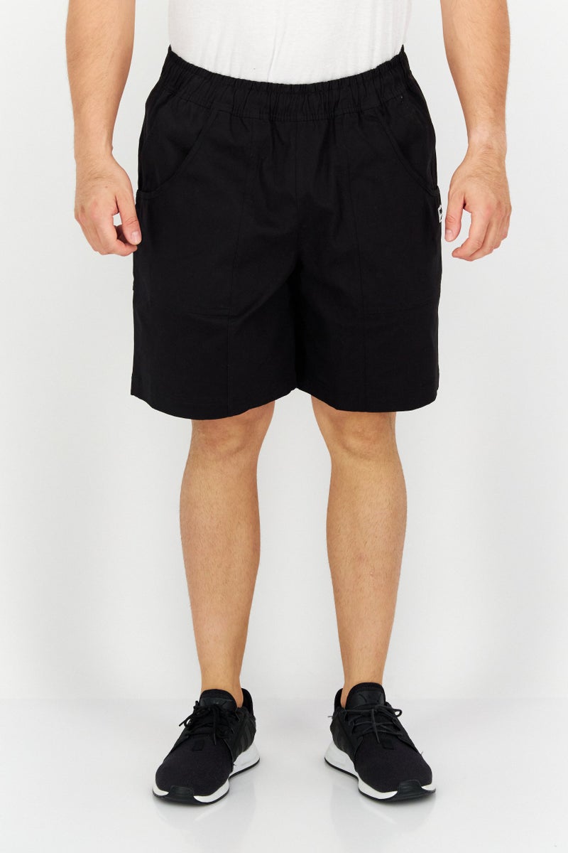 PUMA شورتات تدريب رياضية للرجال بشعار العلامة التجارية، أسود - Image 1